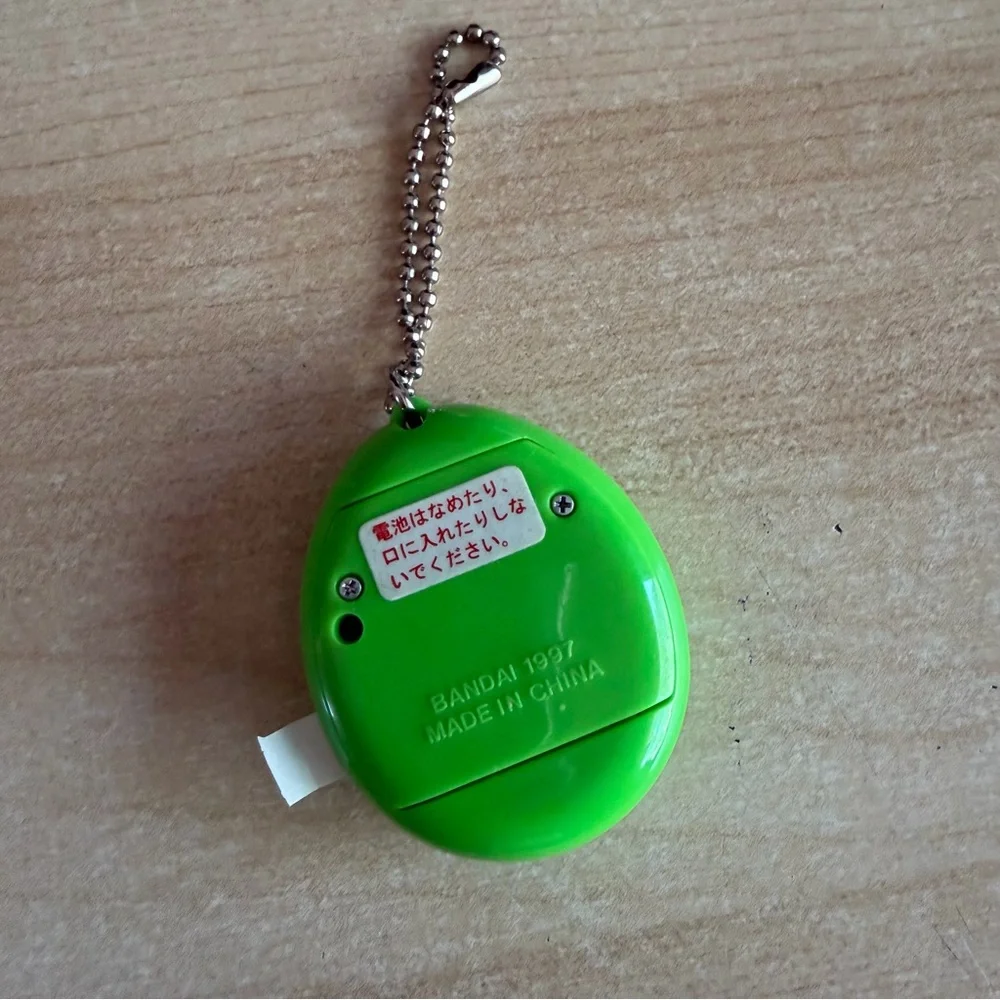 Bandai Tamagotchi Tamagocchi Bright Green Egg Digital Pet Keychain Yellow Green